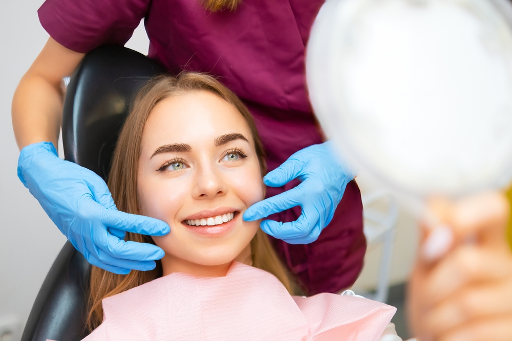 Smile Evaluation During Cosmetic Dental Consultation - Dentist in Madison TN Dentist gently assessing a patient’s smile and facial aesthetics during a personalized cosmetic dental consultation - Dentist in Madison TN